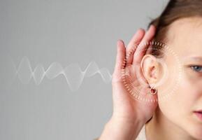 Conceptual illustration of a woman listening attentively with sound waves representing clear sound communication photo