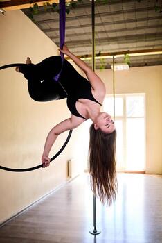 Very difficult exercise On Aerial Hoop photo