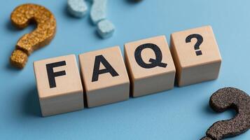Company FAQ Solutions with Clear Answers for Customer Queries And Support. Business Transparency, Client Assistance and Service Excellence. FAQ Written on a Wooden Cubes photo