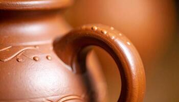 Handcrafted Clay Pot Showcasing Intricate Design and Smooth Handle in a Rustic Workshop Setting, Emphasizing Traditional Pottery Techniques photo