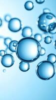 Bubbles Floating in Clear Blue Water Creating a Serene Underwater Atmosphere photo