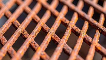 Close-up View of Rusty Metal Grate Showcasing Intricate Patterns and Texture During Daylight Hours photo