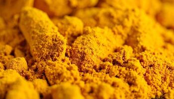 Bright Yellow Turmeric Powder Used in Cooking and Natural Remedies Displayed in a Close-Up View photo
