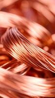 Copper Wires Coiled Together Showcasing Their Shiny Texture and Metallic Luster in Natural Light photo