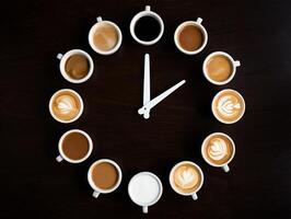 Coffee Background Coffee Clock Twelve Cups of Aromatic Coffee Arranged as a Clock on Dark Wood photo