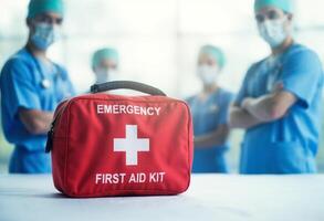Emergency first aid kit with medical staff photo