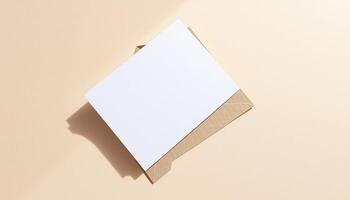 An empty white envelope on a beige background photo