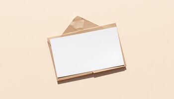 Blank paper envelope on a beige background photo