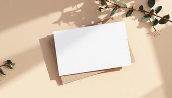 Blank card on a beige background with eucalyptus leaves photo