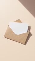 An open envelope with a blank card on top photo
