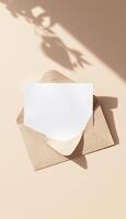 An envelope with a blank card on a table photo