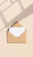 An open envelope with a blank paper on it photo