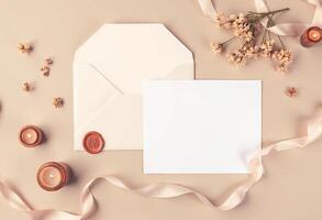 An open envelope with a blank card and candles photo