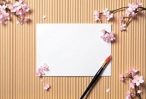 Blank paper with cherry blossom on brown background photo