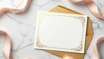 An empty white frame with gold ribbon on a marble surface photo