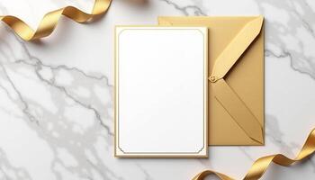Golden envelope with blank card on marble background photo