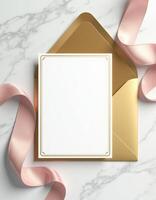 An envelope with a blank card and pink ribbon on a marble surface photo