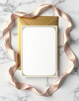 Golden envelope with a blank white paper and a gold ribbon photo