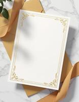An envelope with a blank paper and gold ribbon photo