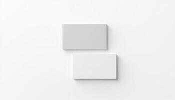Two square white boxes on a white surface photo