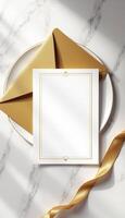 Golden envelope with a blank card on a marble table photo