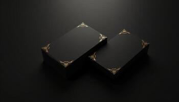 Two black boxes with gold accents on a black background photo