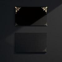 Black and gold business card mockup on a black background photo