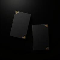 Two black boxes with gold foil on them photo
