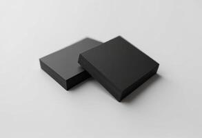 Two black boxes sitting on top of each other photo