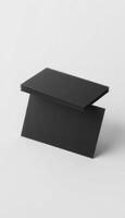 A black rectangular table with a black top photo