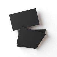 Three black business cards on a white surface photo
