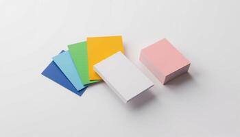 A stack of colorful paper on a white surface photo