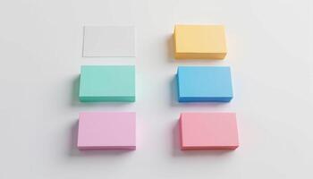 Four different colored sticky notes on a white surface photo