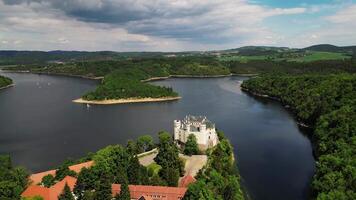 Aerial zoom orbiting view of chateau Orlik and Vltava river in May 2025 in Czechia video