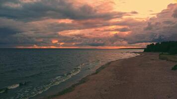 Sunset over the tranquil shores of a quiet beach video