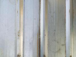 Weathered Silver Metal Wall with Vertical Lines Texture Backgrou photo