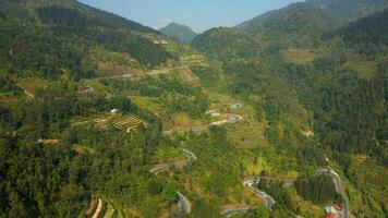 Aerial view of coffee plantations on terraced mountain slopes in Ha Giang, Vietnam. Scenic view of highland farming surrounded by forest and remote countryside. video