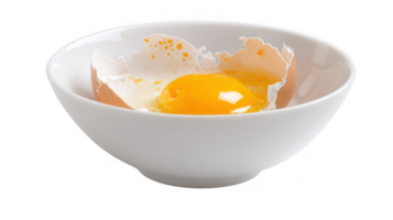 Broken egg yolk in a white bowl on transparent background png