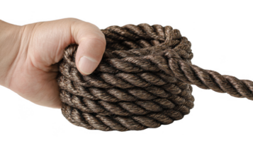 Hand gripping a neatly coiled rope on transparent background png