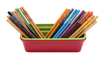 Colorful chopsticks resting in a vibrant container on transparent background png