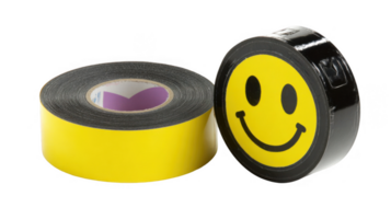 Two rolls of unused tape, one yellow and one black with smiley face, isolated on transparent background png
