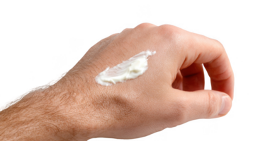 Man applying topical cream on hand with transparent background png