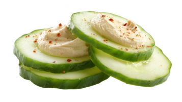 Vibrant cucumber slices topped with creamy hummus and paprika on transparent background png