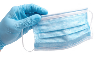 Doctor wearing blue glove holding protective face mask on transparent background png