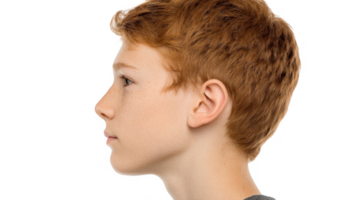 Redhead boy showing profile on transparent background png
