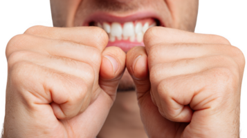 Man suffering strong jaw pain touching face with hands on transparent background png