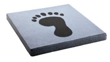 Black footprint marking starting point on soft gym mat with transparent background png