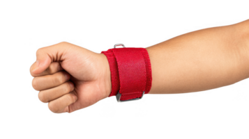 Bodybuilder wearing red wrist wrap making fist on transparent background png