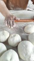 Mastering the Art of Dough Preparation With Skilled Hands and a Wooden Rolling Pin in a Cozy Kitchen video