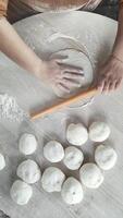 Delicate Dough Preparation for Gozleme With a Wooden Rolling Pin on a Rustic Kitchen Table video